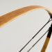 Wooden recurve bow detail with smooth curve design.
