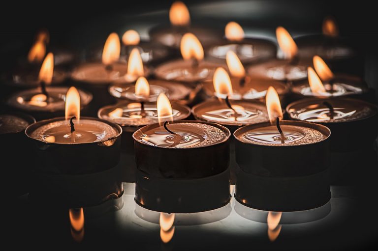 Burning tealight candles creating a warm, ambient glow.