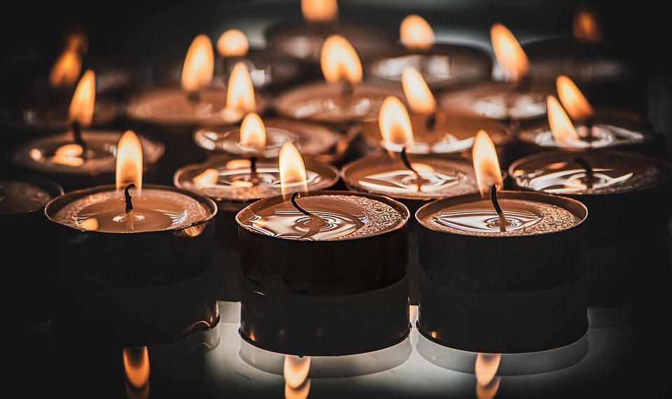 Burning tealight candles creating a warm, ambient glow.
