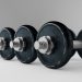 Row of heavy dumbbells on a smooth surface.