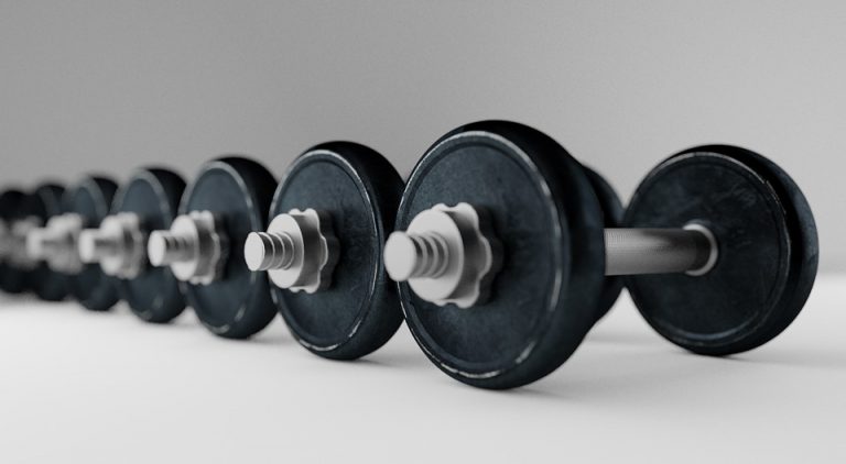 Row of heavy dumbbells on a smooth surface.