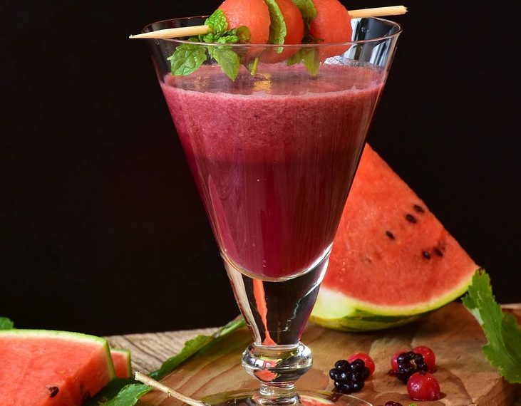 Fresh watermelon smoothie garnished with mint leaves.