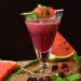 Fresh watermelon smoothie garnished with mint leaves.