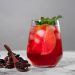 Chilled hibiscus iced tea with citrus slices and mint.