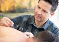 Acupuncturist performing treatment with focus and care.