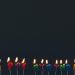 Happy birthday candles glowing against a dark background