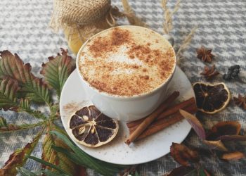 Creamy spiced latte with cinnamon and dried orange.