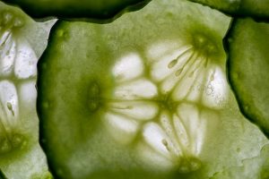 Close-up of fresh cucumber slice with seeds visible.