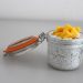 Chia pudding topped with fresh mango cubes in a glass jar.