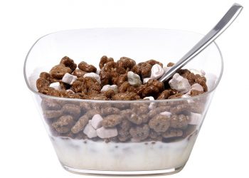 Chocolate cereal and marshmallows in a bowl with milk and spoon.