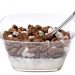 Chocolate cereal and marshmallows in a bowl with milk and spoon.