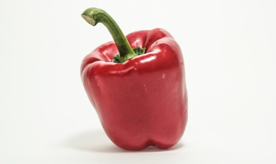 Red bell pepper on white background.