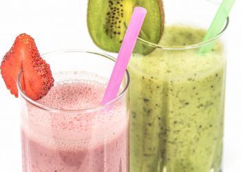 Strawberry and kiwi smoothies with colorful straws.