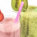 Strawberry and kiwi smoothies with colorful straws.