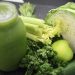 Green smoothie ingredients including celery, cabbage, apple, and greens.