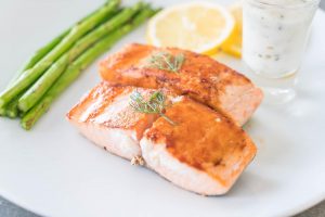 Grilled salmon with asparagus and lemon sauce.
