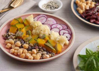Mixed legume and vegetable salad with radishes and pumpkin slices.