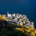 Aerial view of Hallstatt village by a lake in autumn.