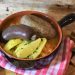 Rustic sausage stew with potatoes and herbs.