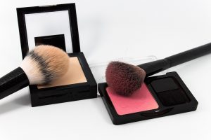Makeup brushes with blush and face powder sets.