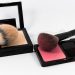 Makeup brushes with blush and face powder sets.