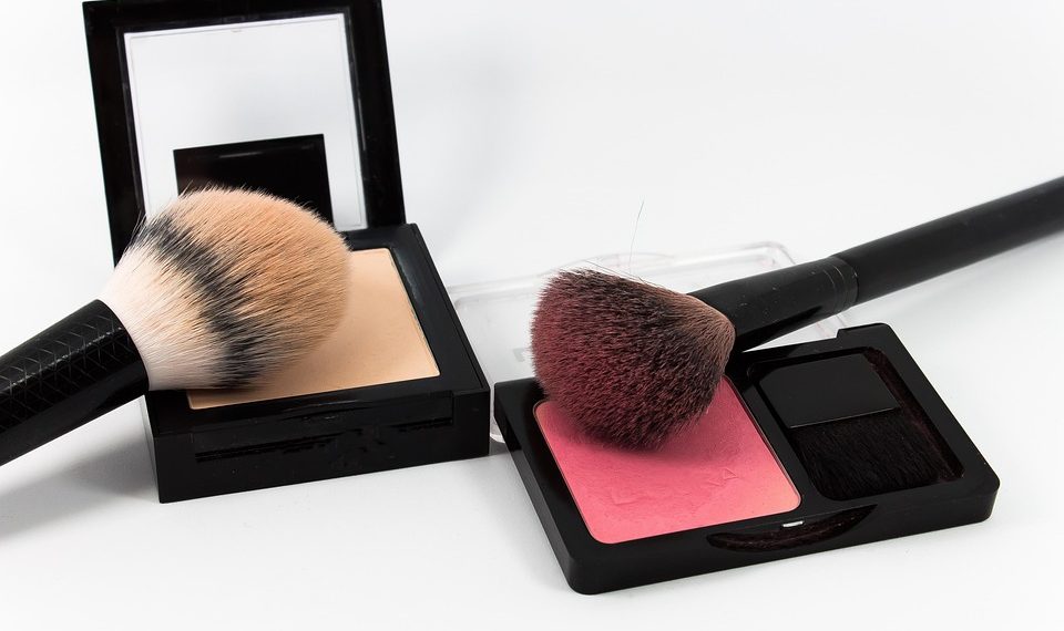 Makeup brushes with blush and face powder sets.