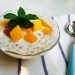 Creamy tapioca pudding topped with mango and mint leaves.
