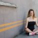 Woman meditating in yoga pose outdoors
