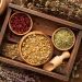 Assorted dried herbs in wooden bowls, perfect for {focus_keyword} herbal remedies.