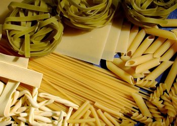 Assorted uncooked pasta varieties, including penne and tagliatelle.