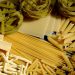 Assorted uncooked pasta varieties, including penne and tagliatelle.