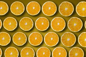 Sliced oranges pattern on a yellow background.