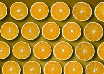Sliced oranges pattern on a yellow background.