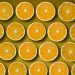 Sliced oranges pattern on a yellow background.