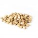 Pile of roasted pistachios on white background.