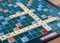 Scrabble board with Polish words spelled using tiles.
