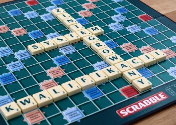 Scrabble board with Polish words spelled using tiles.