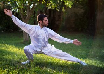 Man practicing Tai Chi in a park.