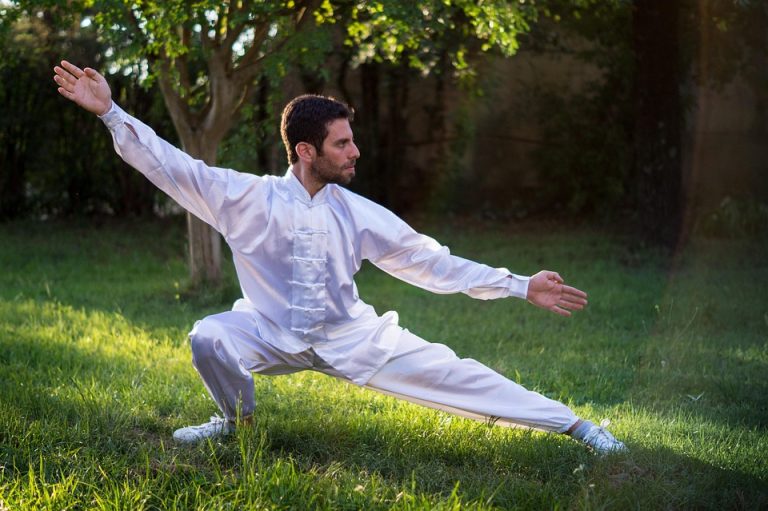 Man practicing Tai Chi in a park.