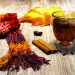 Cozy autumn tea with cinnamon, star anise, and a colorful knitted scarf.