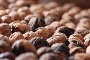 Shelled walnuts in a pile, highlighting texture.