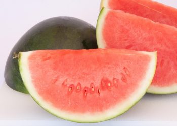 Sliced watermelon segments on a white background.
