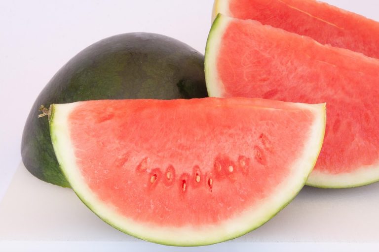 Sliced watermelon segments on a white background.
