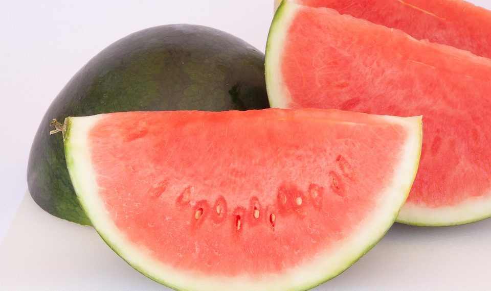 Sliced watermelon segments on a white background.