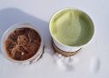Chilled iced chocolate and hot matcha latte on snow.