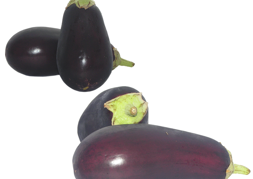 Cluster of fresh eggplants on white background.