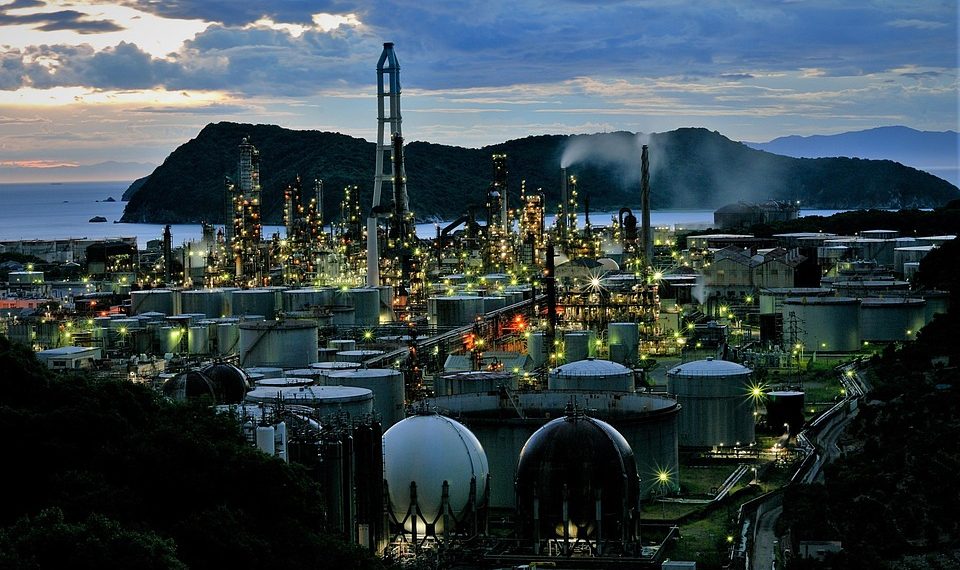 Night view of industrial refinery with bright lights.