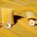Paccheri pasta tubes and daisies on striped pasta sheets.