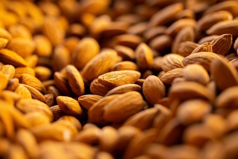 Whole almonds in a close-up shot showcasing texture.