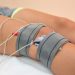 Electrode therapy on knee for pain relief using electrotherapy.